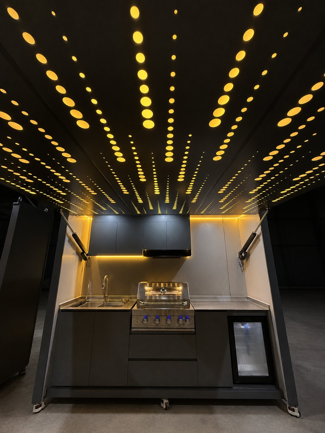 Completed outdoor kitchen configuration under factory lighting review